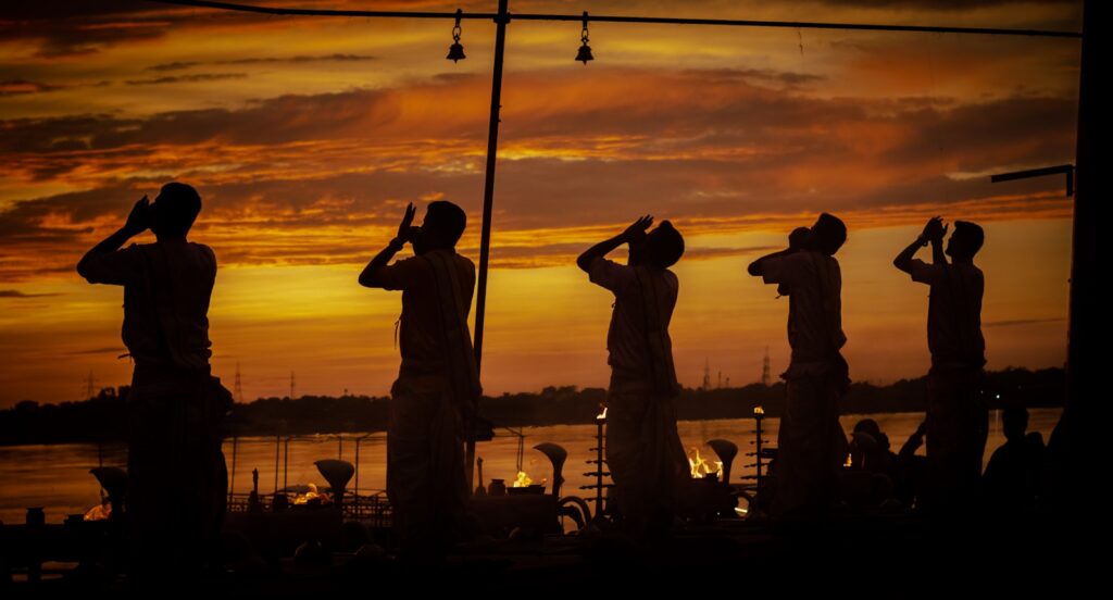 silhouette of people standing on a beach